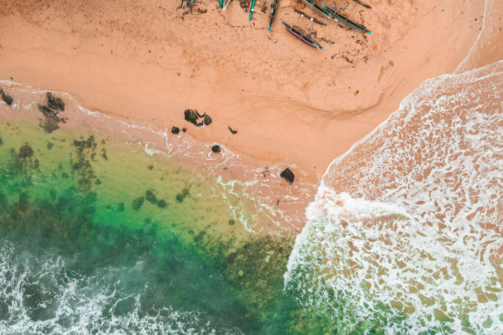 Clear shallow water running onto the sand on the southern coast