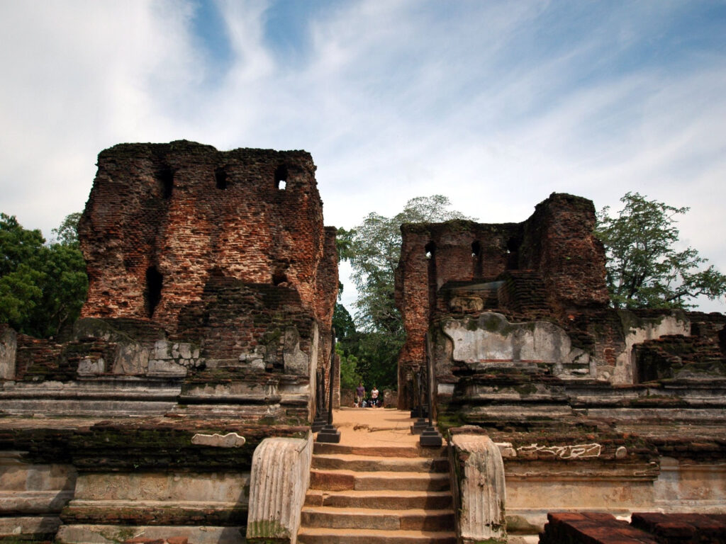 A stone stairway and carved brickwork among the ruins of an ancient Sri Lankan city