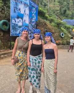 Three guests at the entrance to an adventure centre