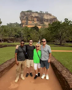 Guests standing in front of Sigiriya rock