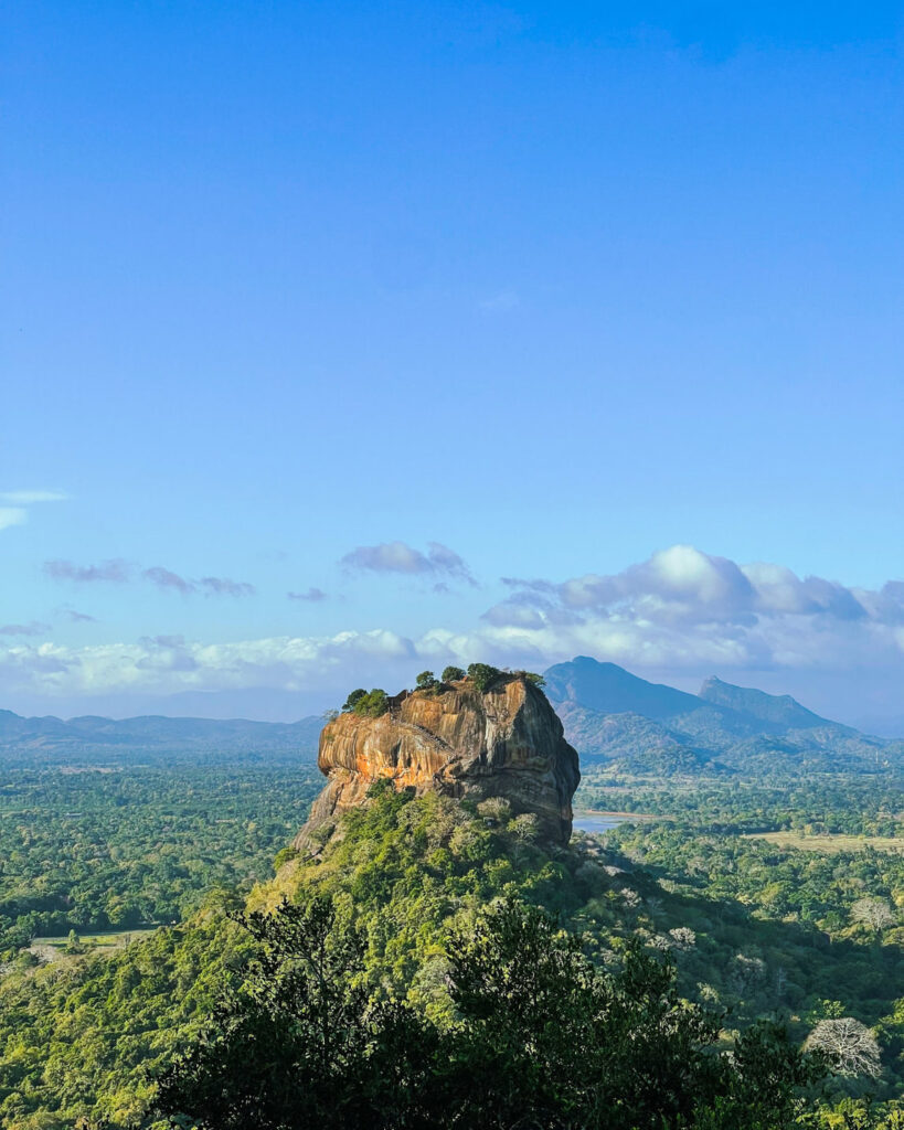 Sigiriya rock rising above the surrounding forest