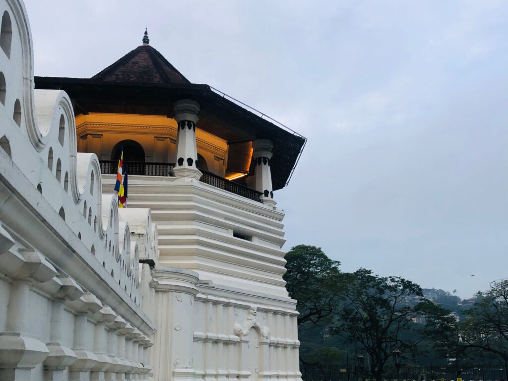 The octagonal tower and white walls of the Temple of the Sacred Tooth Relic in Kandy