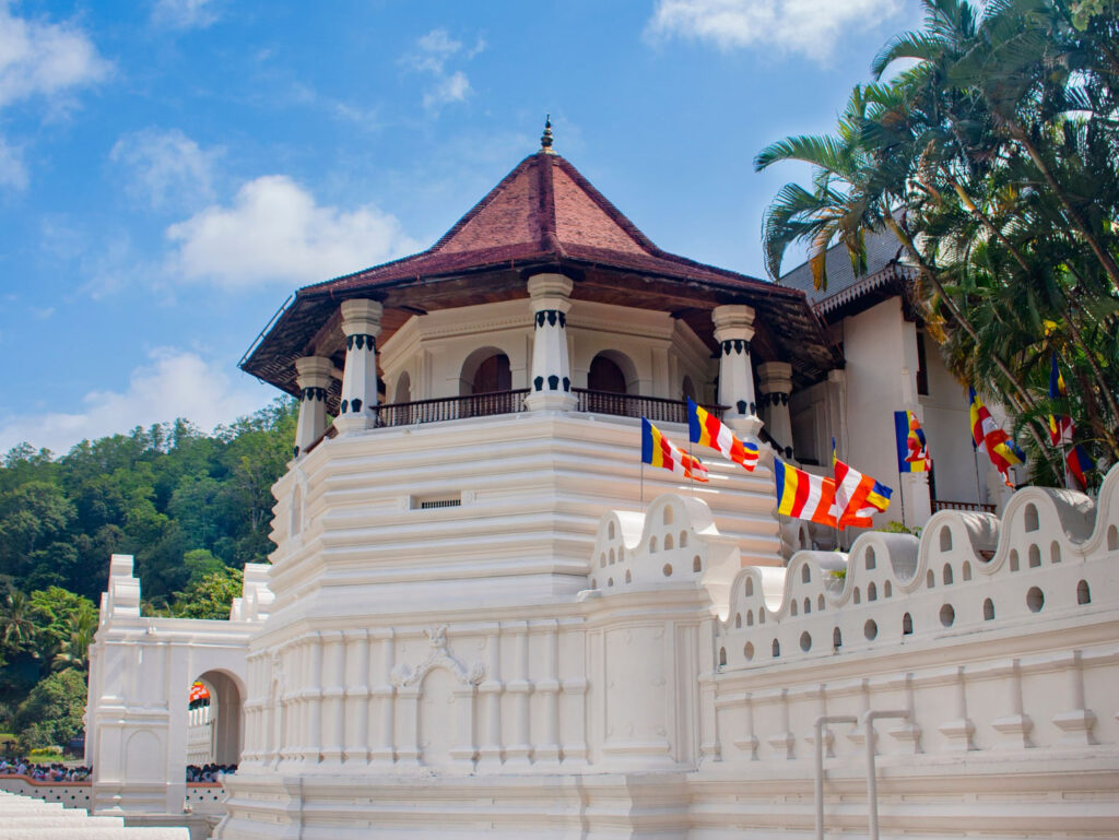 The Temple of the Sacred Tooth Relic in Kandy, Buddhist flags along its wall